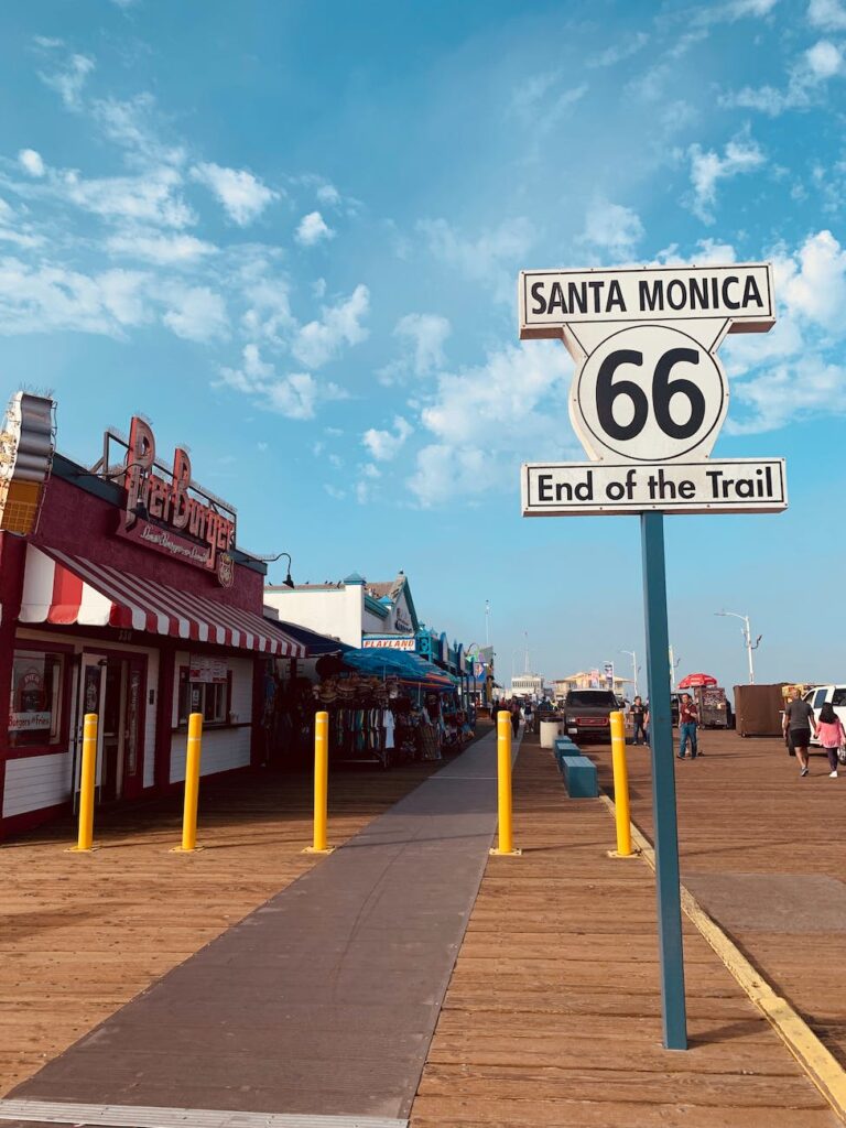 white and black sign under blue sky