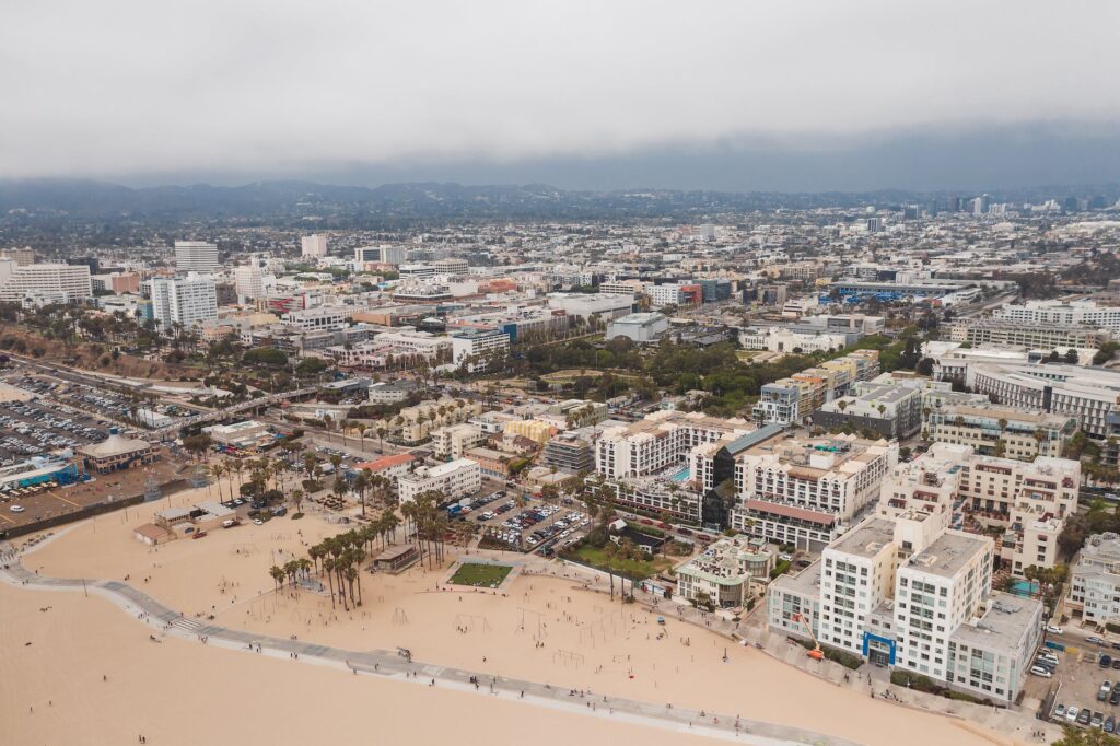 an aerial shot of buildings by the santa monica beach