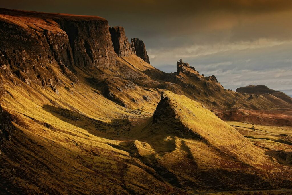 brown cliffs under gray sky