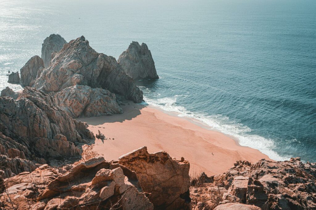 photo of rock formation near sea