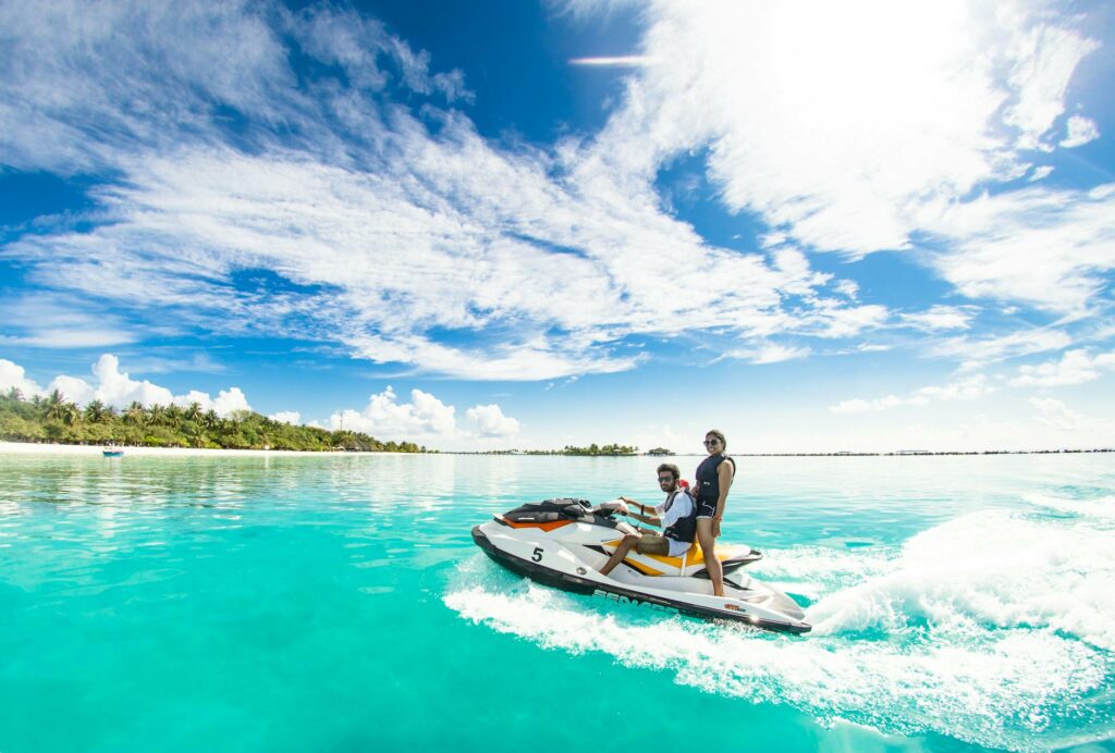 two people riding a jet ski